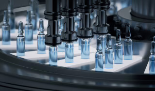 Automated glass ampoule filling line in a pharmaceutical manufacturing facility