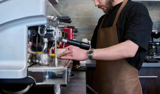 Man using coffee machine